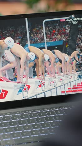 vertical video bucharest, romania - july 30th 2024 - leader supporting the national swimmer