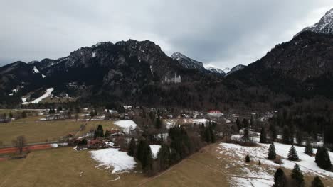 side to side aerial drone shot of neuschwanstein castle in the winter, germany