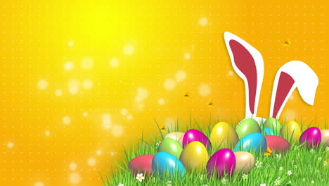 easter colored eggs on green grass and rabbit ears. abstract yellow background with blurred particles. looped video.