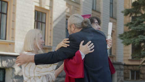 proud parents celebrate son's graduation