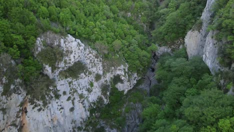 aerial drone view of cliff near albanian canyon "syri i ciklopit