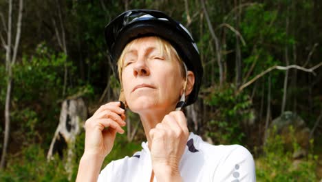 senior cyclist wearing bicycle helmet at countryside 4k