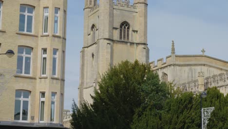 Tilt-down-along-iconic-tan-English-turret-tower-in-Cambridge-England