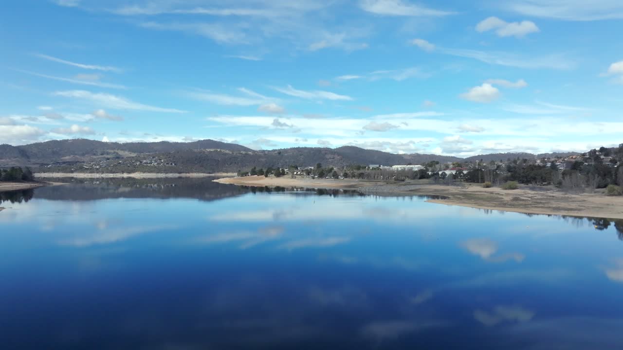 Aerial: Drone reveal shot of Jindabyne in the snowy mountains, NSW, Australia