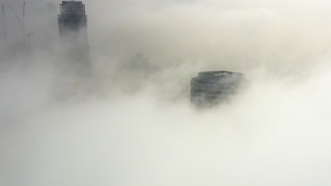 cityscape shrouded in morning fog