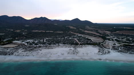 drone shot in side view of la ventana beach and breakwater in baja california sur mexico