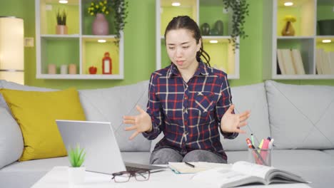 Frustrated-young-Asian-woman-seeing-her-failure-on-a-laptop.