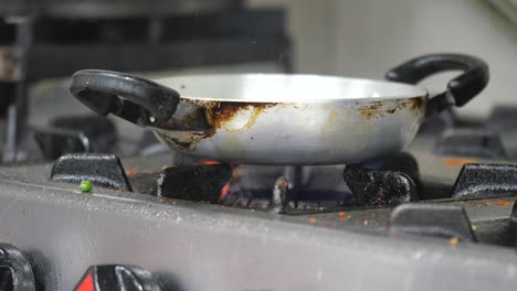 small pan on a gas stove