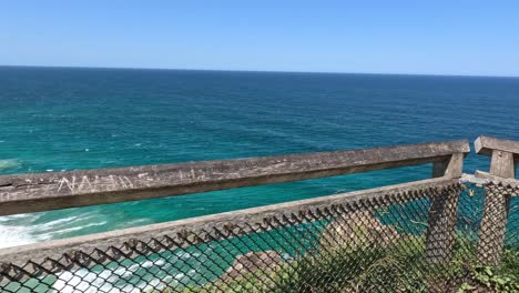 time-lapse of ocean waves from a coastal fence