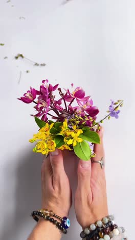 flowers in hands with bracelets