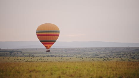 slow motion shot of balloon ride on adventure safari holiday in beautiful landscape of masai mara, kenya, african scenery in maasai mara national reserve, kenya, africa safari vacation