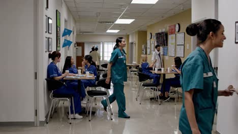 hospital corridor with nurses and staff