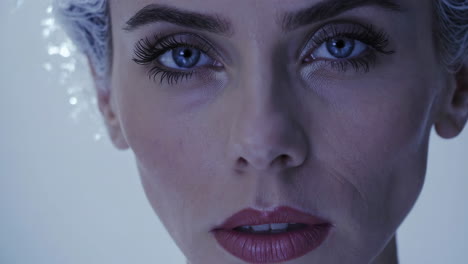 close-up portrait of woman with winter/ice-themed makeup