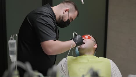 dentist performing dental procedure on patient