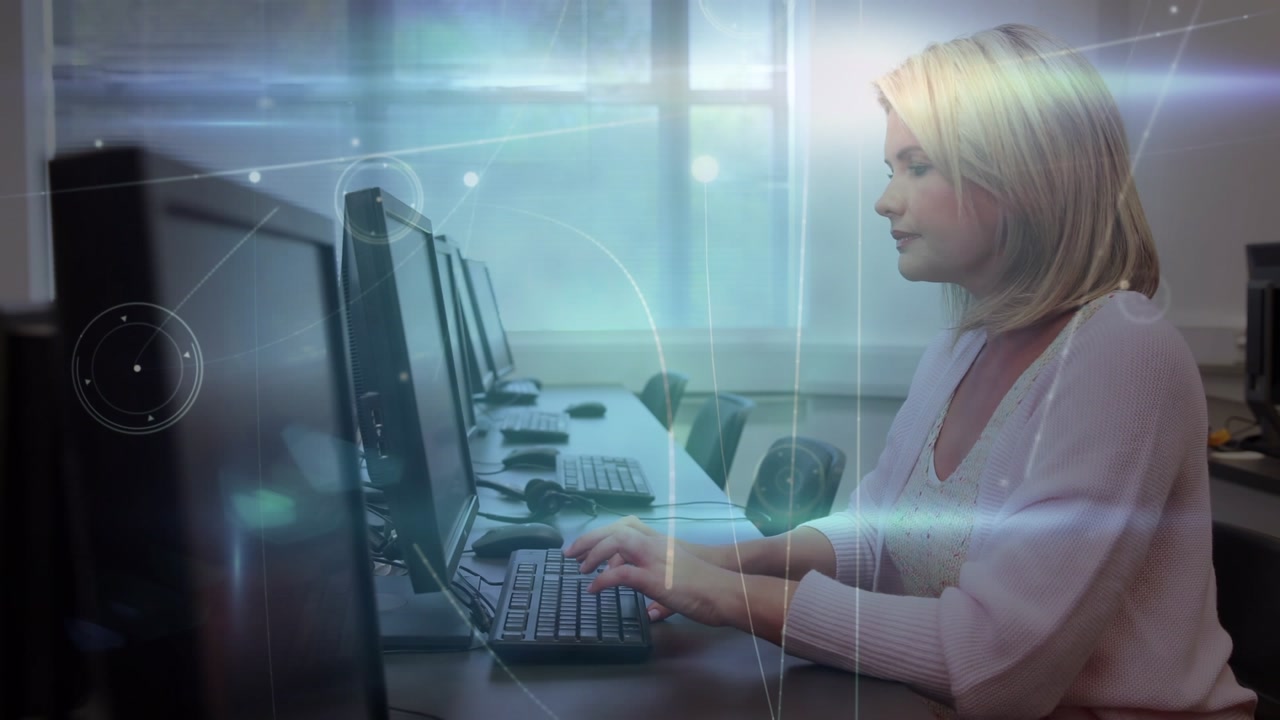 Animation of network of connections over caucasian female teacher using computer in classroom