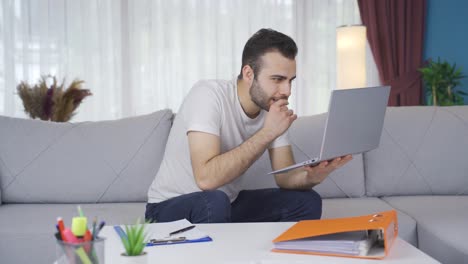 Man-looking-at-computer-screen-is-working-very-carefully.