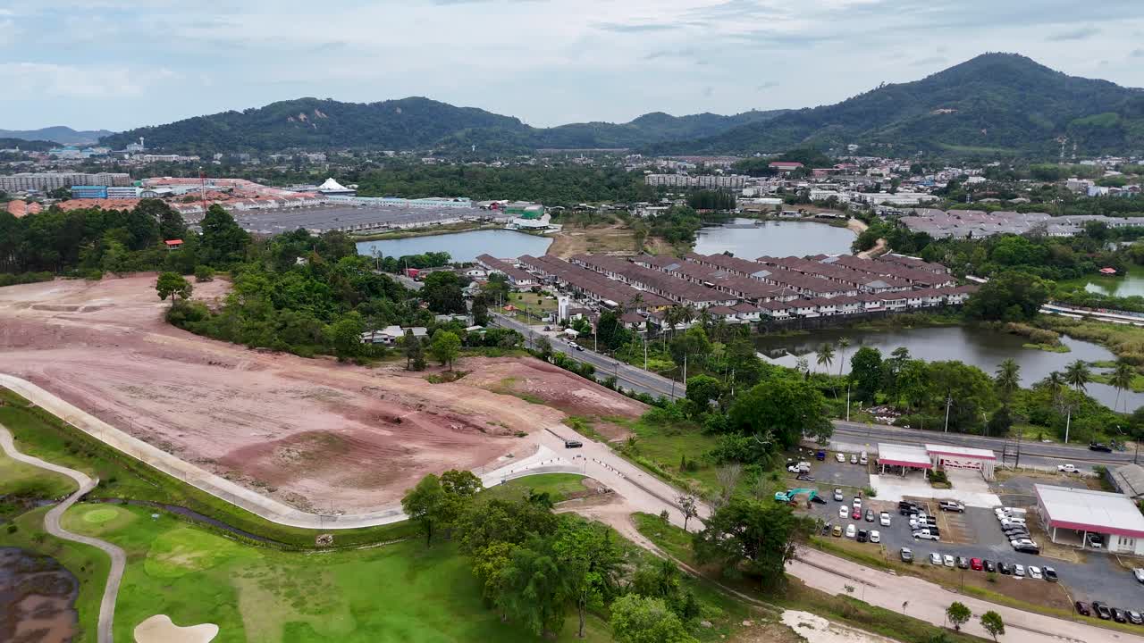 Aerial footage showcases a golf course under construction in Phuket, Thailand, highlighting lush greenery and surrounding landscapes