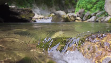 Clean-water-flowing-in-the-stream.-Slow-motion.