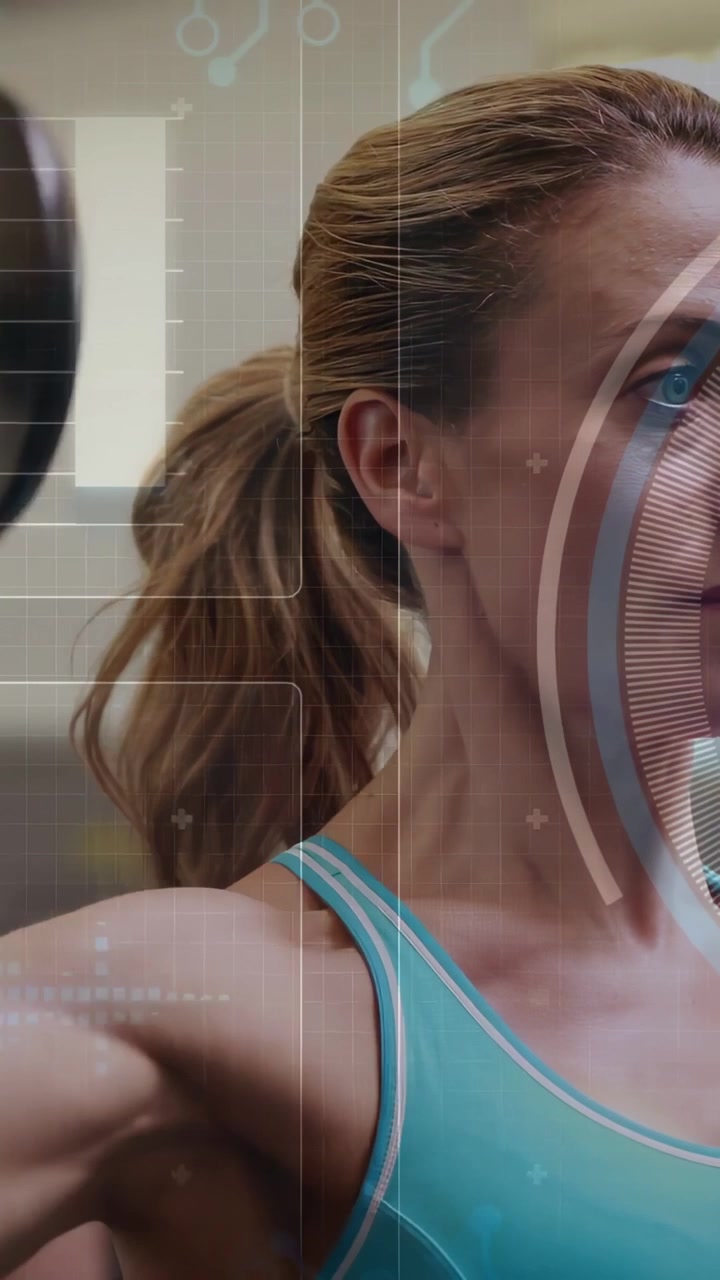 Vertical video: Female exerciser starting rep lifting dumbbell, HUD guiding shoulder form in gym