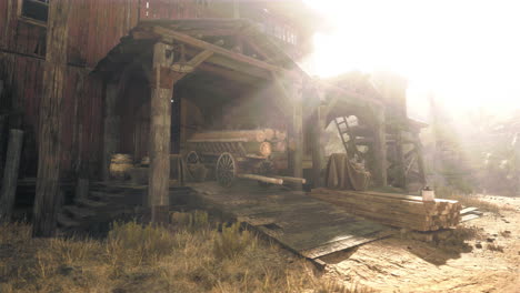 rustic old barn and sawmill at sunset