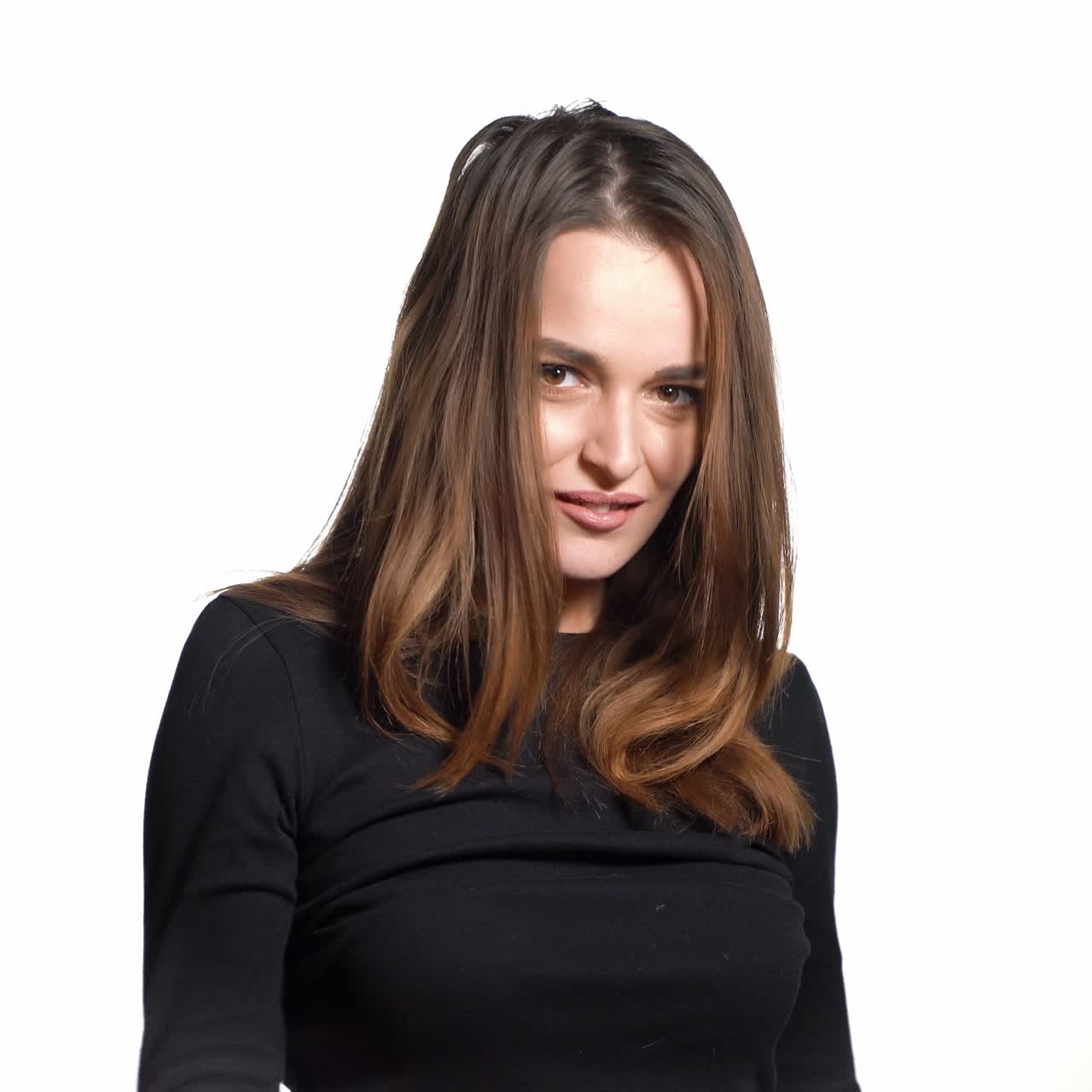 Brunette with shopping bags on white background. Successful caucasian fashion brunette after buying clothes. Shopaholic concept.