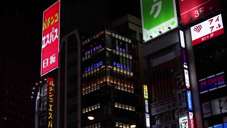 illuminated signs and ads in a vibrant city at night