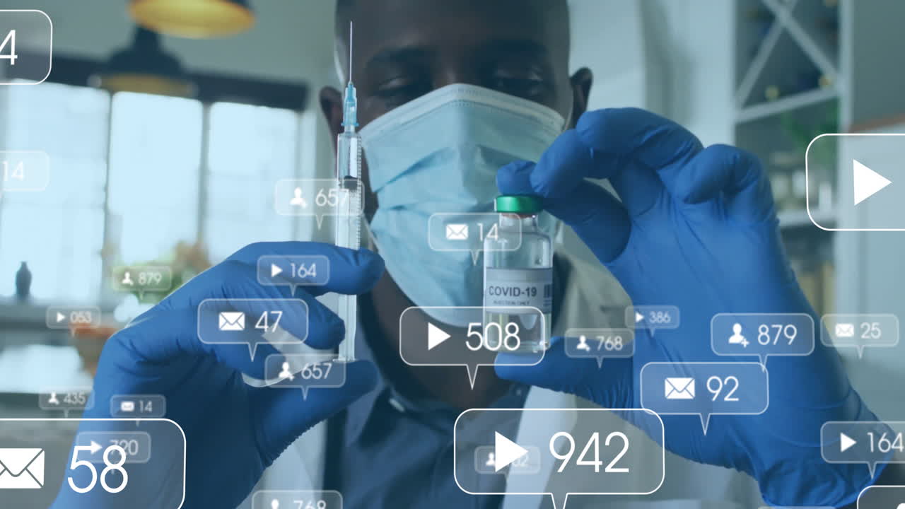 Male medical professional holding syringe and COVID-19 vial in lab, with social icons floating