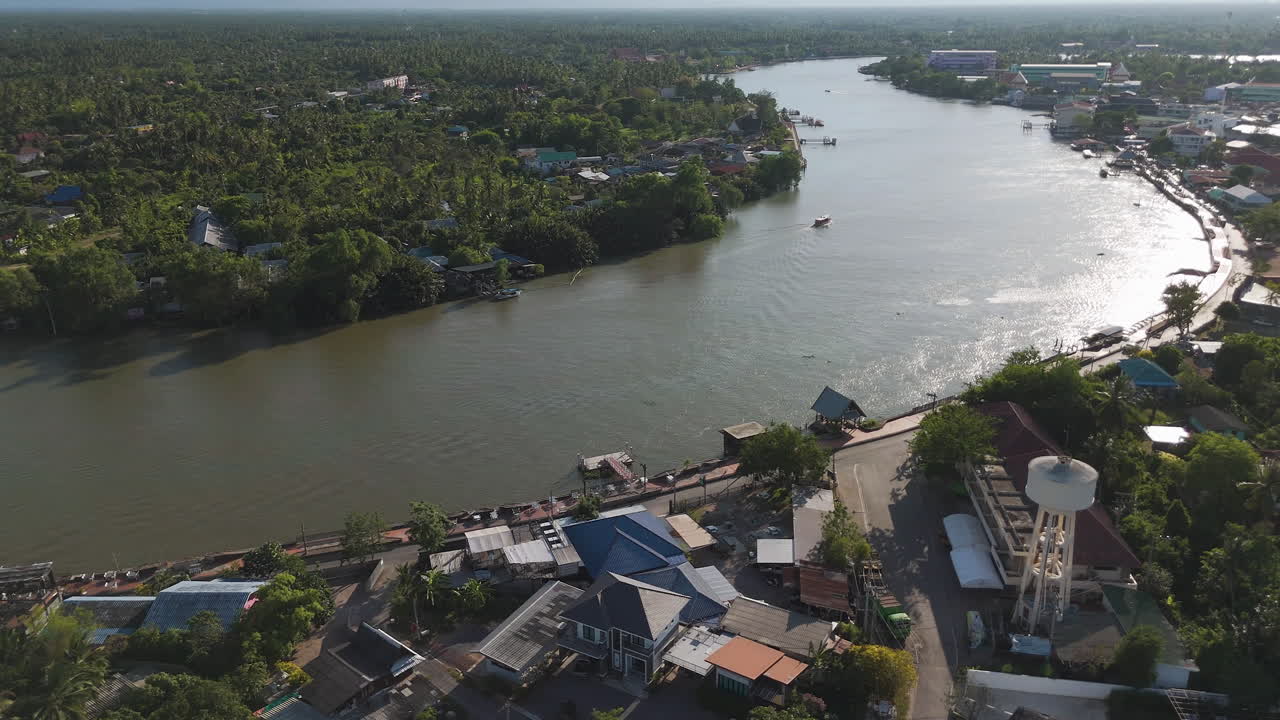 Above View Of Riverside Town In Mae Klong Near Amphawa Floating Market In Thailand. Aerial Drone Shot