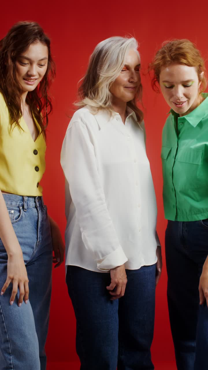 Three women of different generations posing together