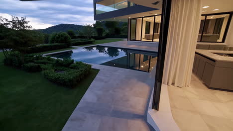 modern house with swimming pool and garden at dusk