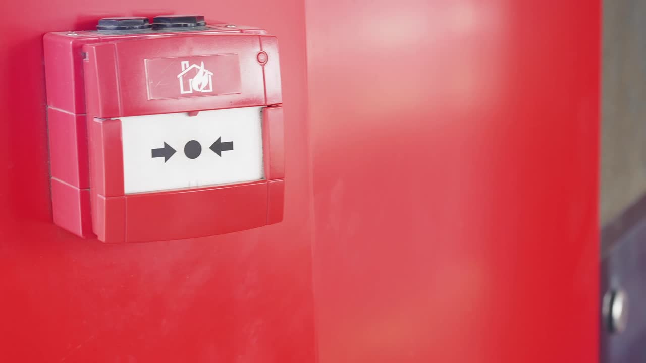 Red Fire Alarm Panel on Wall