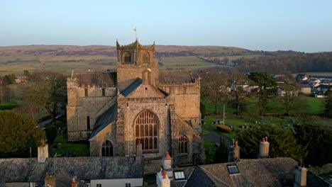 Aerial-footage-of-the-Medieval-village-of-Cartmel-in-the-English-Lake-District-it-has-a-rich-heritage,-and-varied-list-of-activities-for-visitors-and-tourists