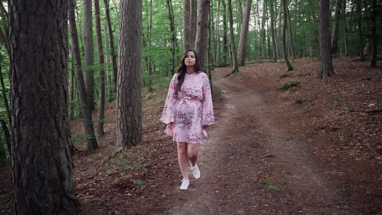 Young Girl In Dress Walking Through The Forest. - full shot