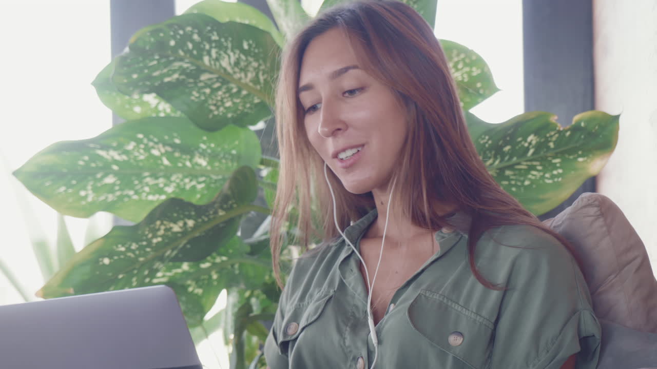 Freelancer Using Laptop by Green Plant