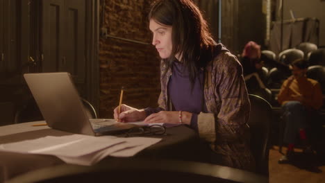 portrait of female playwright at work in theater