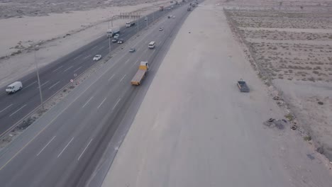 desert highway traffic aerial footage – fly forwards