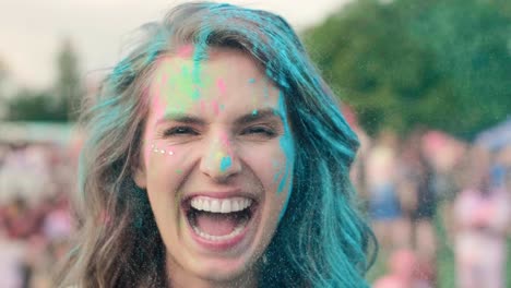 happy woman in holi colors