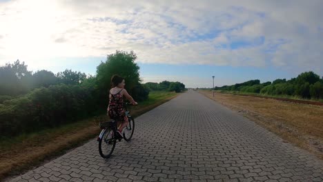 girl riding the bicycle on the summertime