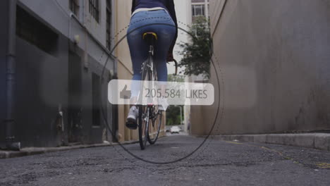 animation of social media like notification over african american woman riding bike in street