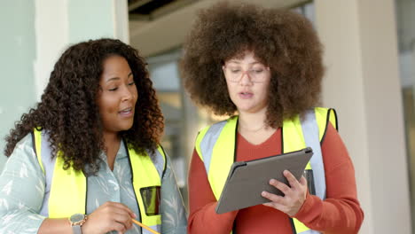 Casual-diverse-female-architects-working-in-office,-slow-motion-with-copy-space