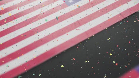 animation of confetti falling over flags of united states of america