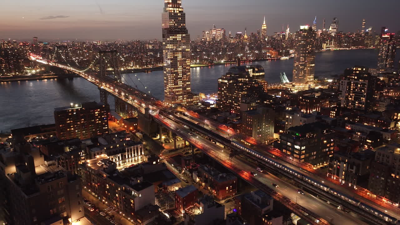Aerial view of the subway crossing the Williamsburg Bridge. Shot at sunset in New York City.