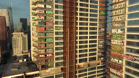 4k aerial of graffiti tower in dtla in february 2024, los angeles, california, usa