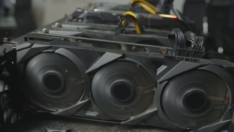 close up of cryptocurrency mining rig working, fans of graphic card working