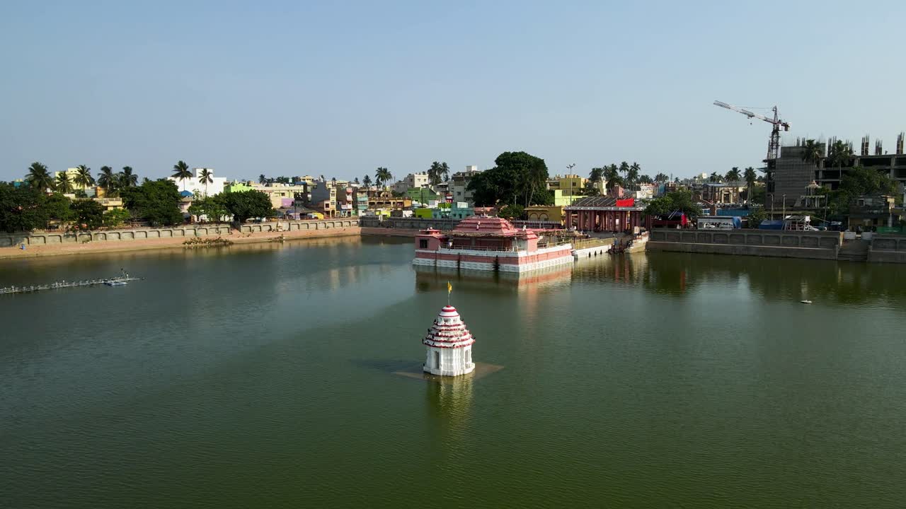 Aerial drone shot capturing the grandeur of the Jagannath Puri temple complex amidst the busy streets of the city.