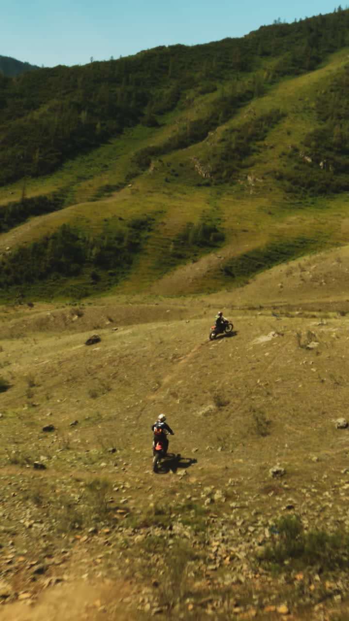 Motocross race against landscape of highlands. Display of agility and speed with riders weaving through natural obstacles in quest for supremacy