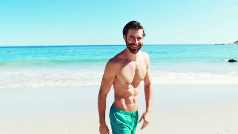 Young-man-taking-a-video-at-beach