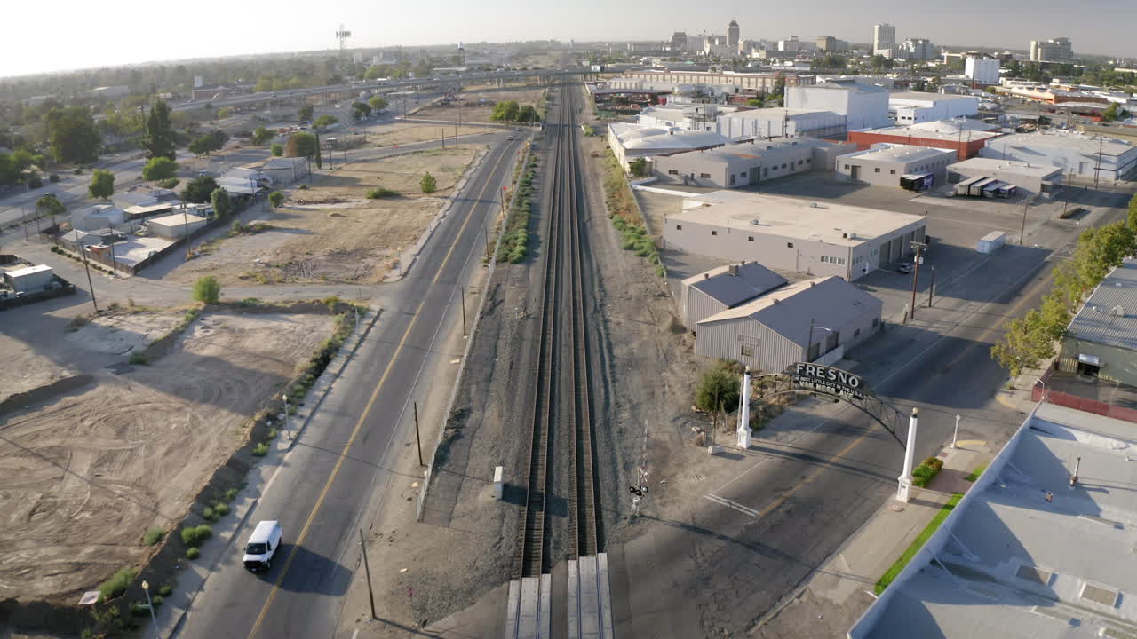 Aerial view of Fresno with train tracks and urban landscape