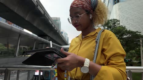 woman using smartphone in urban city