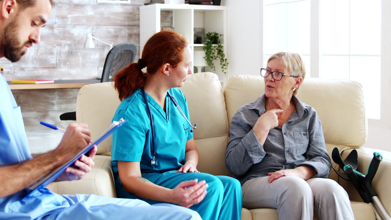 Male assistant writing rehabilitation treatment